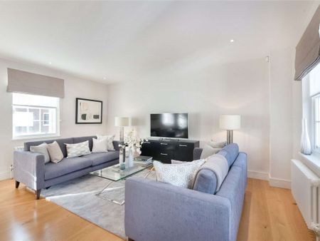 A luxuriously appointed two bedroom apartment in this converted period building in Belgravia benefitting from wood flooring. - Photo 2