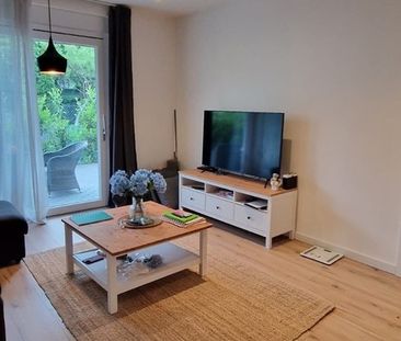 Przestronne mieszkanie z ogrodem i garażem - Zdjęcie 1