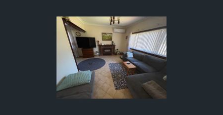 Charming 2-Bedroom Home with Sunroom and Lovely Gardens - Photo 3