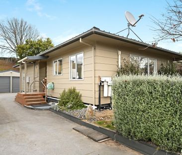 Modern and low-maintenance, this 3-bedroom, 1-bathroom home with a ... - Photo 5