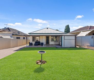 Air-Conditioned Three-Bedroom Home with Updated Kitchen and Tiled Living Areas! - Photo 1