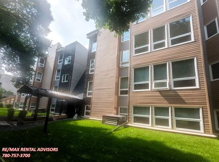 GREAT 2 BED+DEN, 2 BATH CONDO WITH IN-SUITE LAUNDRY & HEATED UNDERGROUND PARKING IN THE COMMUNITY OF OLIVER - Photo 2