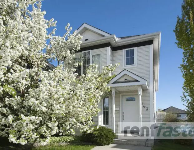 TWO STORY BRIGHT SUNNY HOME FOR YOU; TWO BEDROOMS & LOFTED DEN | 163 Hidden Cresent, Calgary - Photo 1