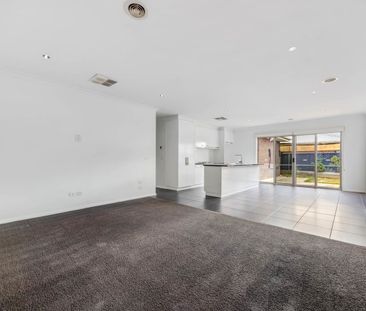 Designed with practicality in mind, this neat three-bedroom home of... - Photo 3