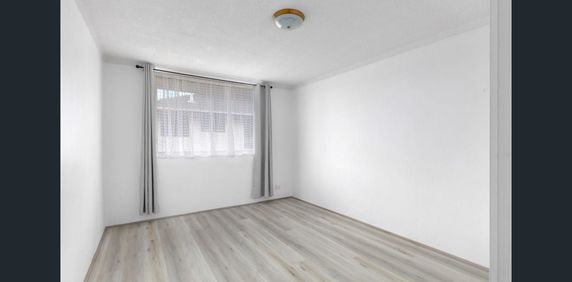 Neat Two-Bedroom Apartment with Open Living and Carport - Photo 2