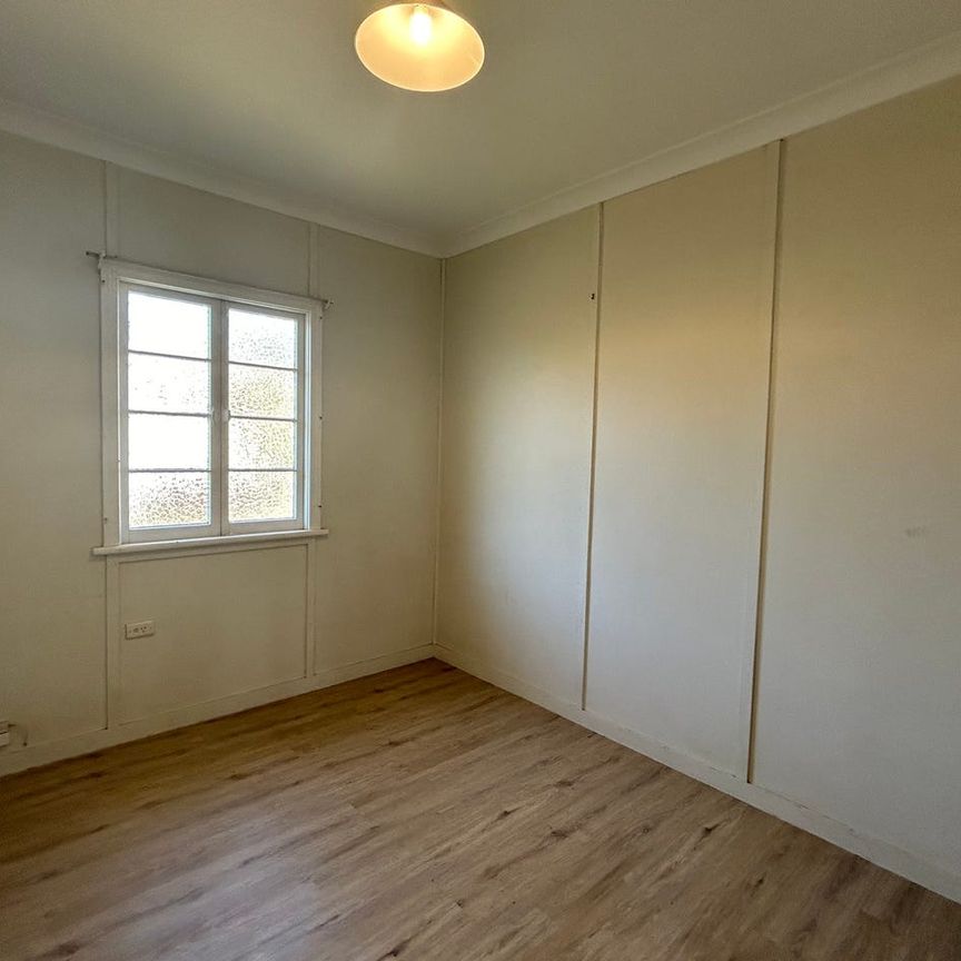 THIS BEAUTIFUL QUEENSLANDER IS AVAILABLE NOW - NEW FLOORING INSTALLED THROUGH OUT! - Photo 1