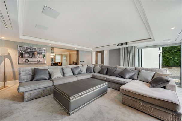 An exceptional contemporary home of over 5,000 sq ft, set behind electric gates on one of Hale Barns' most prestigious roads. - Photo 1