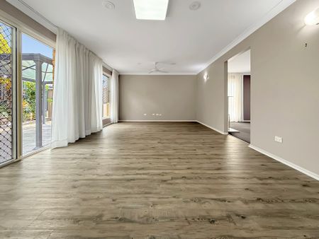 Spacious High Set Family Home with Multiple Living Areas & Moreton Island Views - Photo 2