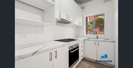 FRESHLY PAINTED, SPACIOUS UNIT WITH LOCK UP GARAGE - Photo 2