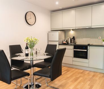 A fully furnished, one-bedroom apartment with a private balcony and... - Photo 3