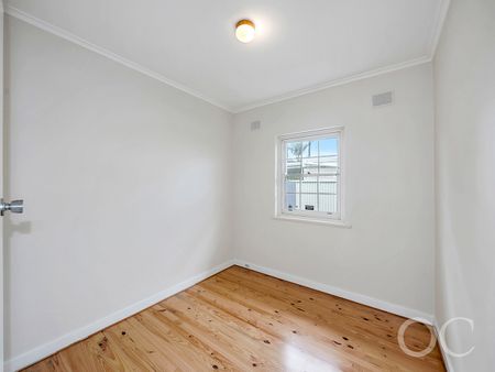 Open the Door to Classic Comfort Just Steps from the Coast - Photo 4