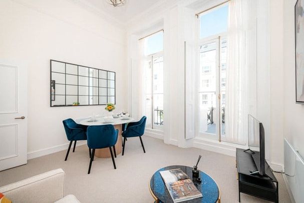 A well-presented first floor (with lift) two bedroom, two bathroom flat that benefits from its own private balcony, located on the west side of Lexham Gardens. Tenancy Length: Minimum 12 months EPC Rating C | Council Tax Band F - Photo 1