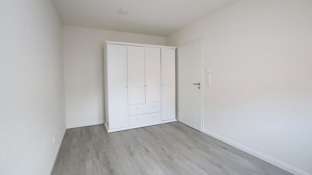 Neuwertige Erdgeschosswohnung mit Terrasse und Pkw-Stellplatz in Westerstede – zentrale Wohnlage - Photo 1