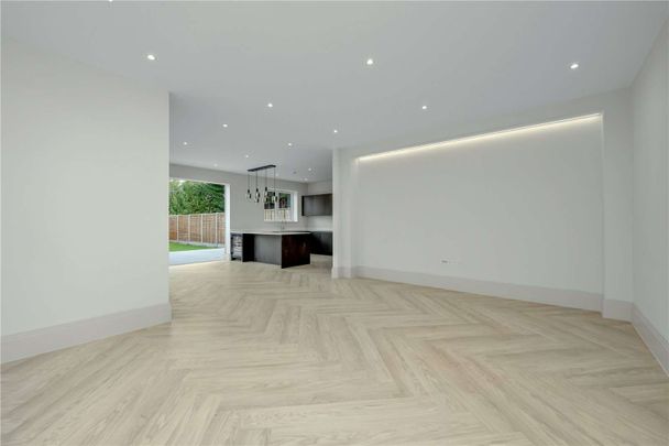 Beautifully finished new-build home just 0.5 miles from Walton-On-Thames Station. This five bedroom family residence combines contemporary design and cutting-edge technology. - Photo 1