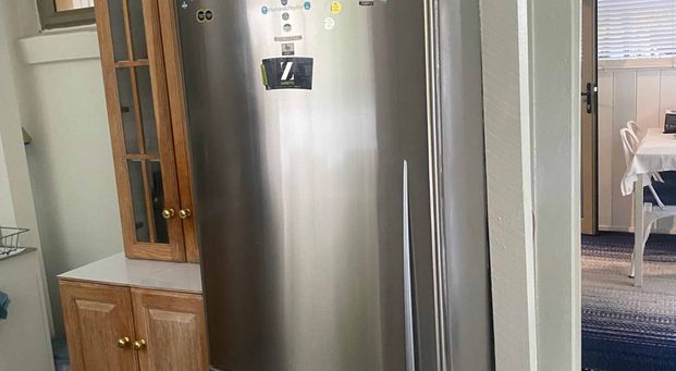 Unit under the house with private backyard - Photo 1