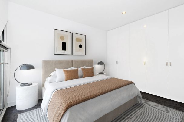 Modern Two-Bedroom Townhouse with Balcony and Secure Garage - Photo 1