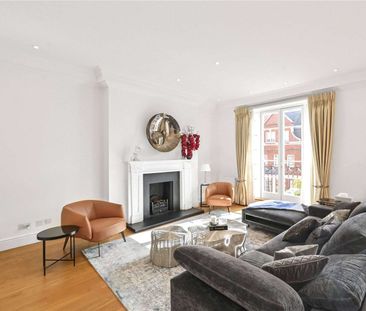 An elegant beautifully presented third and fourth floor duplex penthouse with a balcony and private roof terrace. - Photo 1