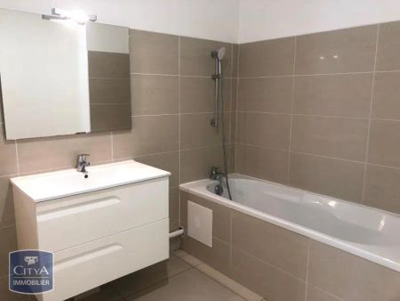 Appartement à louer 3 pièces 69m² - Photo 4