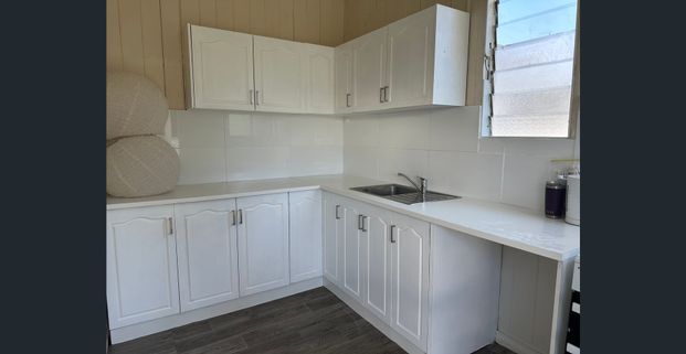 Live in the heart of Sandgate Village - Photo 1