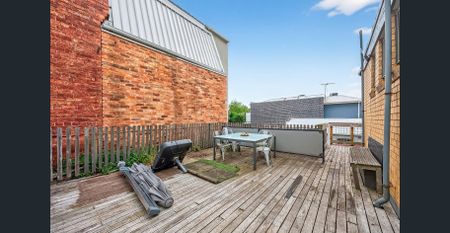 4-Bedroom Home with Terrace in Vibrant Location - Photo 2