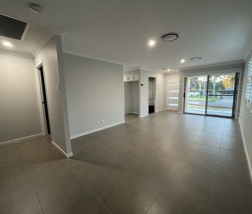 Stylish Modern Home with Ducted A/C & Water Included - Photo 1