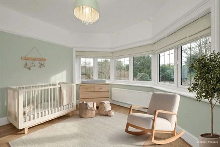 A well-presented family home with period charm, modern interiors, and spacious accommodation arranged over three floors. - Photo 5