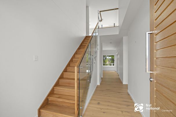 BRAND NEW STUNNING HOME WITH BREATHTAKING VIEWS OF MORETON BAY AND STRADBROKE ISLAND - Photo 1