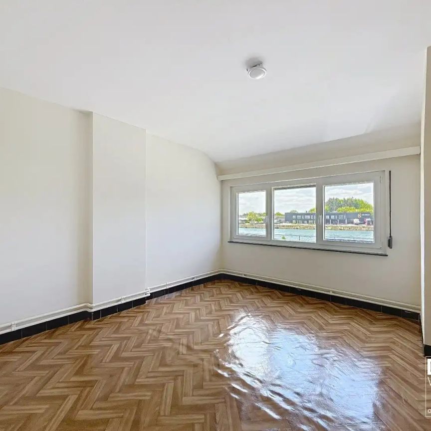 RUIME WONING MET TUIN, GARAGE & 3 SLAAPKAMERS RUSTIG GELEGEN LANGS HET KANAAL MET EPC C TE BERINGEN - Photo 1