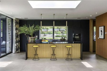 An exceptional contemporary home with quality interiors and landscaped gardens in an elevated position with village and open country views. - Photo 4
