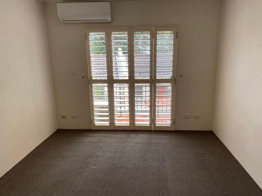 Spacious Two-Bedroom Townhouse With Parking - Photo 1