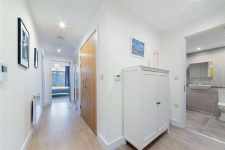 A stunning two bedroom, two bathroom flat located on the first floor of a modern development on Barking Road. - Photo 4