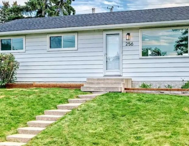 Newly renovated with bright open layout, modern finishes and close to amenities | 256 Penbrooke Close Southeast, Calgary - Photo 1