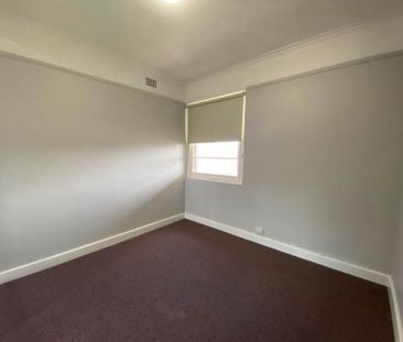 -Centrally located large two bedroom unit with sun room. - Photo 1