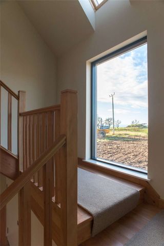 Modern 4-bedroom countryside home with open-plan living, luxury kitchen, stylish bathrooms and stunning views. - Photo 2