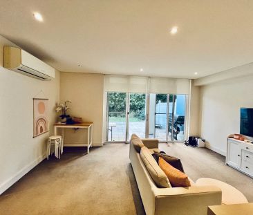 Stylish Apartment Living Surrounded by Waterfront Serenity - Photo 1