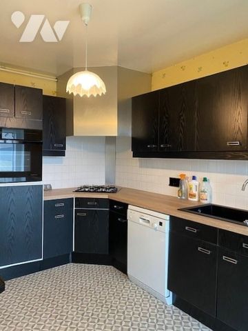 Appartement F3 avec balcon, garage et 2 caves dans une résidence sécurisée - Photo 3