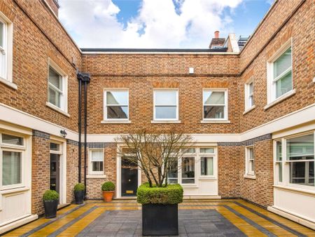 A beautiful four bedroom mews house boasting a private patio and double garage, located in the heart of Belgravia. - Photo 3