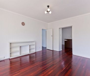 COMFORTABLE FOUR-BEDROOM HOME IN PRIME LOCATION - Photo 1