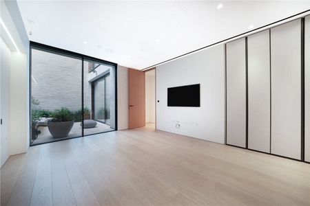 An immaculate three bedroom duplex with private courtyard patio (ground and lower ground floors) that is part of a new modern development in a quiet street close to Holland Park, High Street Kensington and Notting Hill Gate. EPC rating: B | Council Tax Band H - Photo 3