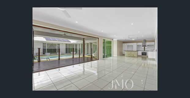 Comfortable Family Home with Multiple Living Areas & Pool - Photo 1