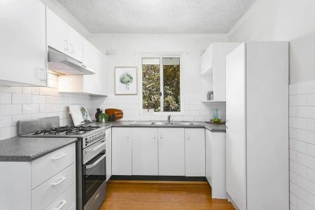 Prized top floor unit bathed in natural light - Photo 3
