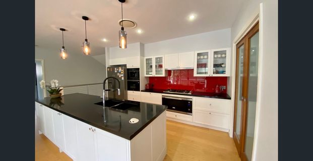 Stylish Family Home with Multiple Living Spaces - Photo 1