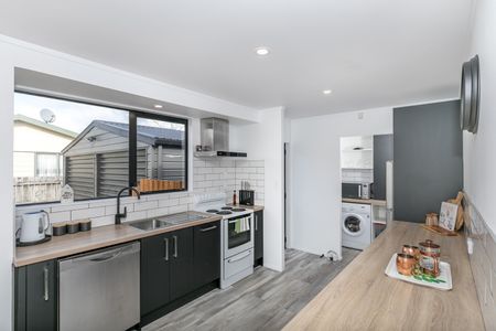 This beautifully refreshed four-bedroom, single-bathroom home offers modern living in a prime Nawton location. - Photo 4