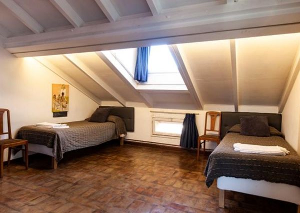 Attic-Monti: 1-6 month rentals. Spacious, furnished 3 Bedroom, 2 bath, living room, dining room, study and large panoramic terrace. Bright, silent, located in well kept Palazzo d’Epoca with elevator and doorman. Near transport and Metro.