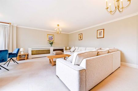 A first floor three bedroom apartment with large wrap around terrace and river views in a secure development with underground parking. - Photo 2