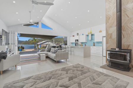 Sublime Deep Waterfront Home with Jetty & Boatshed/Games Room Fully Furnished - Photo 2