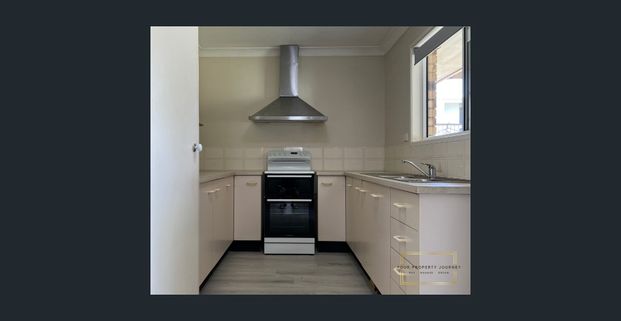 A tidy home on a large block hard to find! - Photo 1