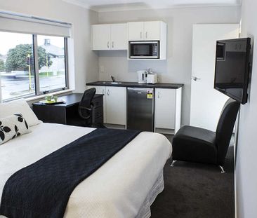 This is a modern, fully furnished studio unit. - Photo 3