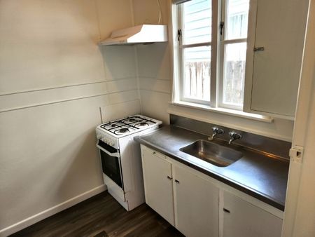 Step inside this beautifully recently renovated one-bedroom unit featuring new carpet, fresh paint, and new vinyl flooring throughout. - Photo 2