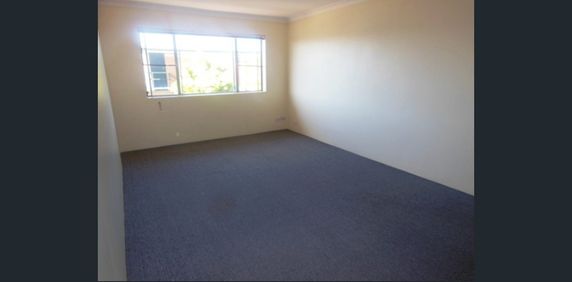 TOP FLOOR LIVING IN QUIET CLAYFIELD COMPLEX - Photo 2